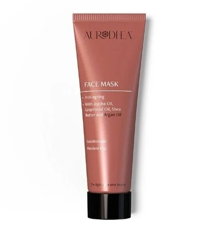 Masque facial anti-âge à l'huile d'argan de la marque chogan, montrant la texture crémeuse dans un bol blanc.